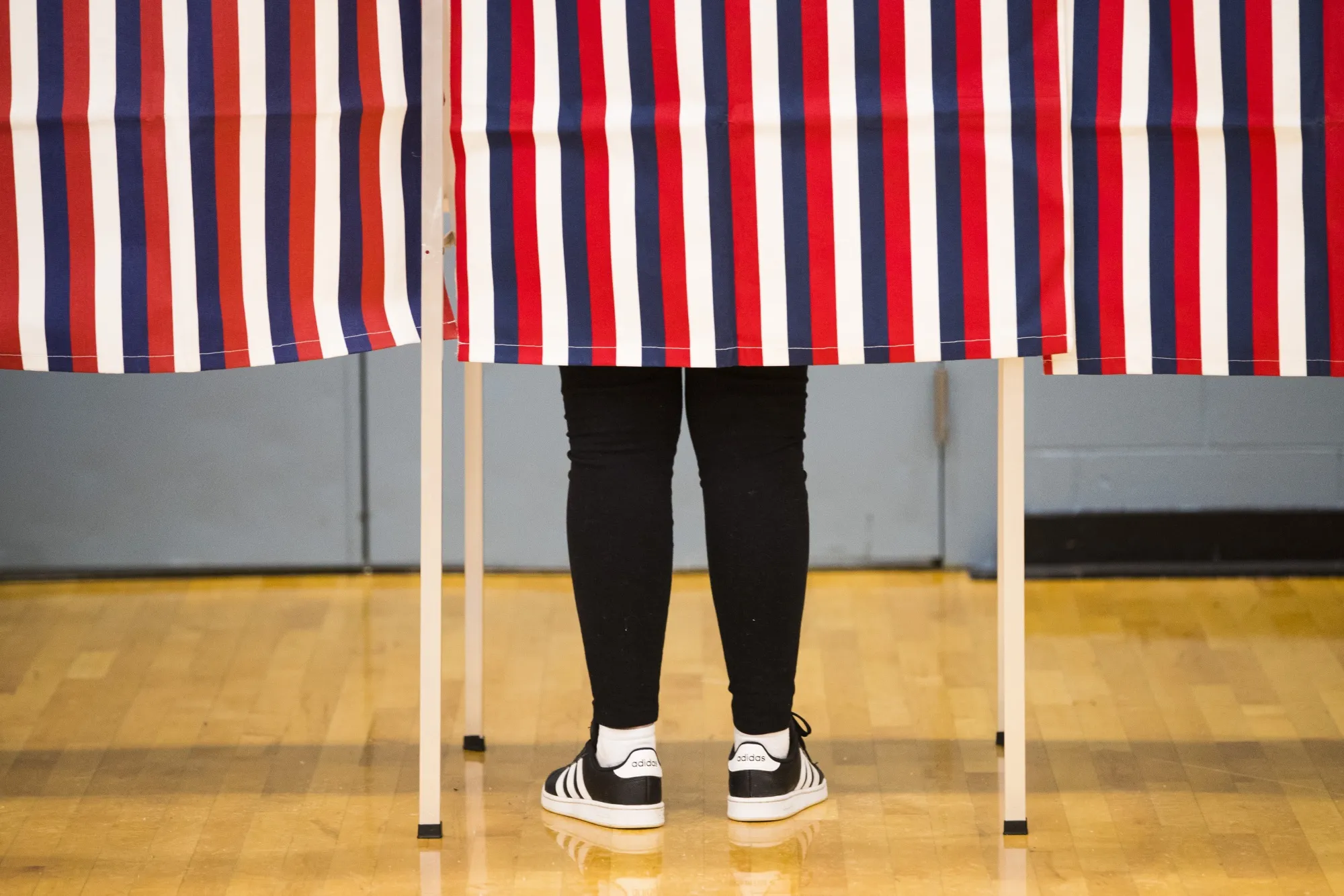 A voter casts a ballot at a polling station in Durham, New Hampshire.
