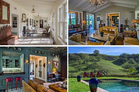 The public rooms of the 8,000-square-foot residence open to a covered porch and an outdoor fireplace, plus a pool. There are five fireplaces inside, a library, bar, caterer's kitchen, and breakfast room.