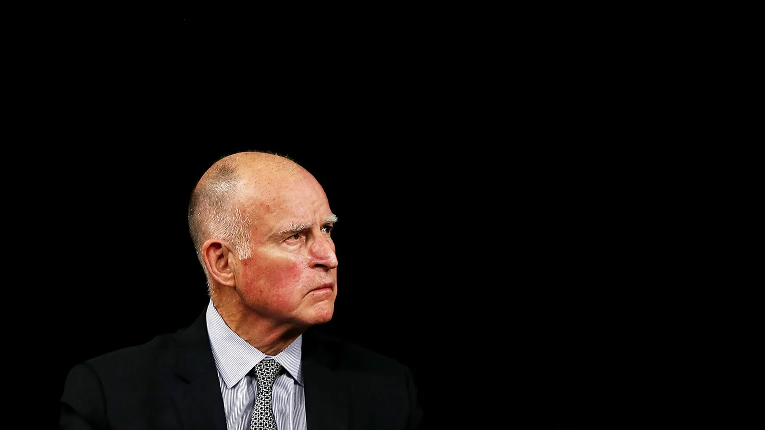 California governor Jerry Brown looks on as Israeli prime minister Benjamin Netanyahu speaks at the Computer History Museum on March 5, 2014 in Mountain View, California.
