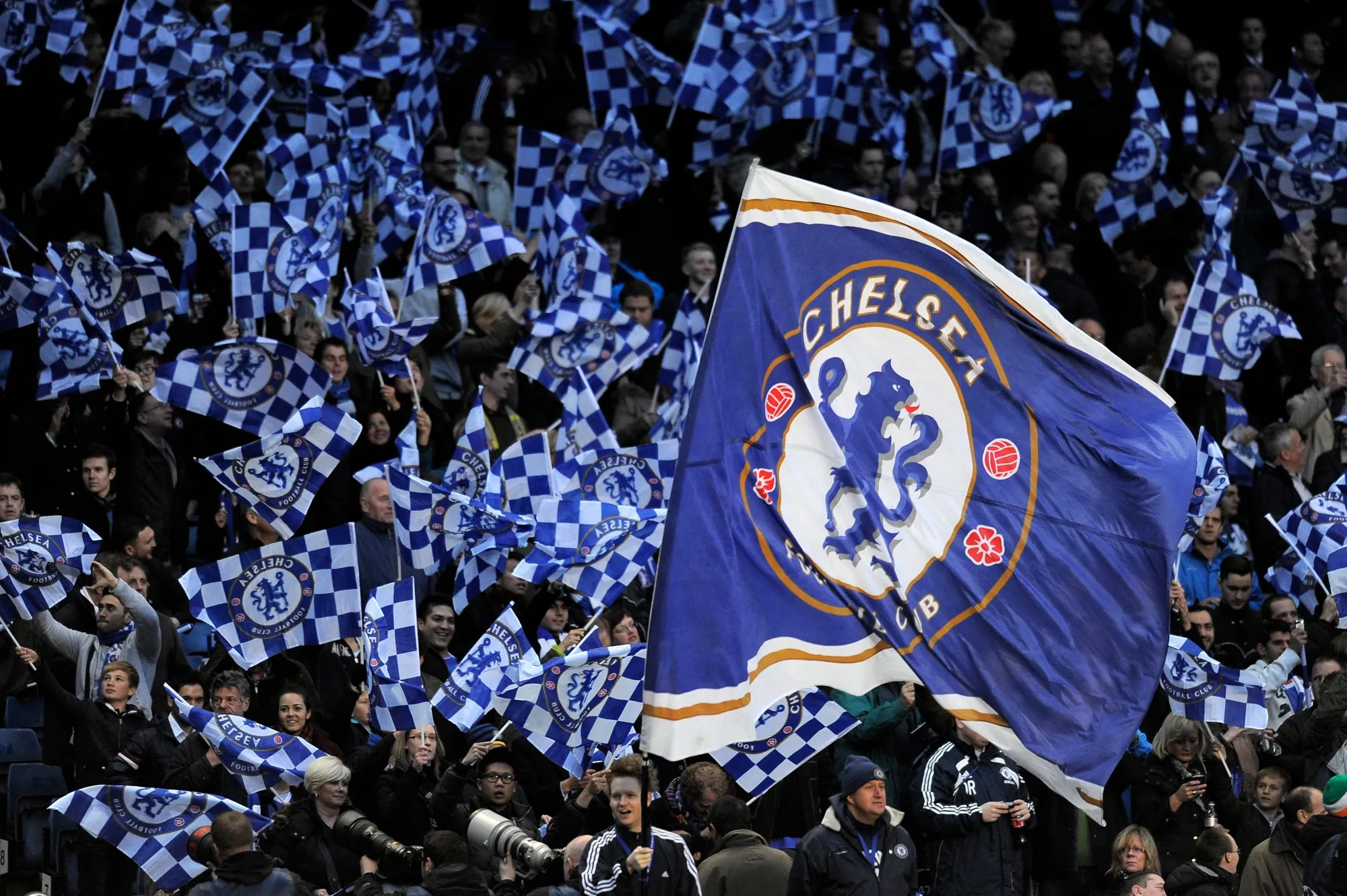 Chelsea fans wave flags at Stamford Bridge in London.