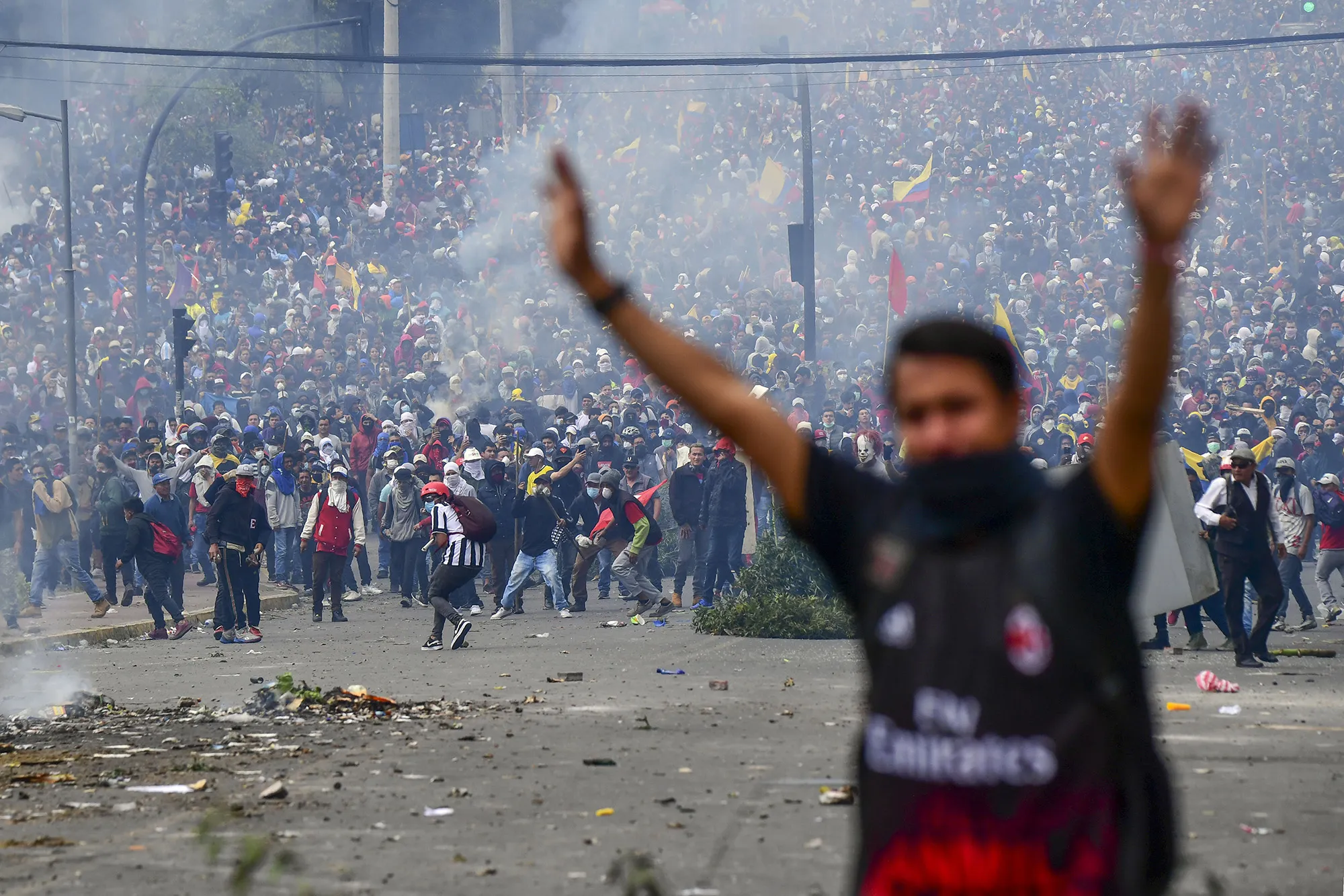 Demonstrators clash with riot police near the national assembly in Quito on Oct. 8.