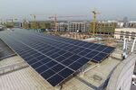 Solar panels on the rooftop of an office building in Xi'an, China. Bloomberg