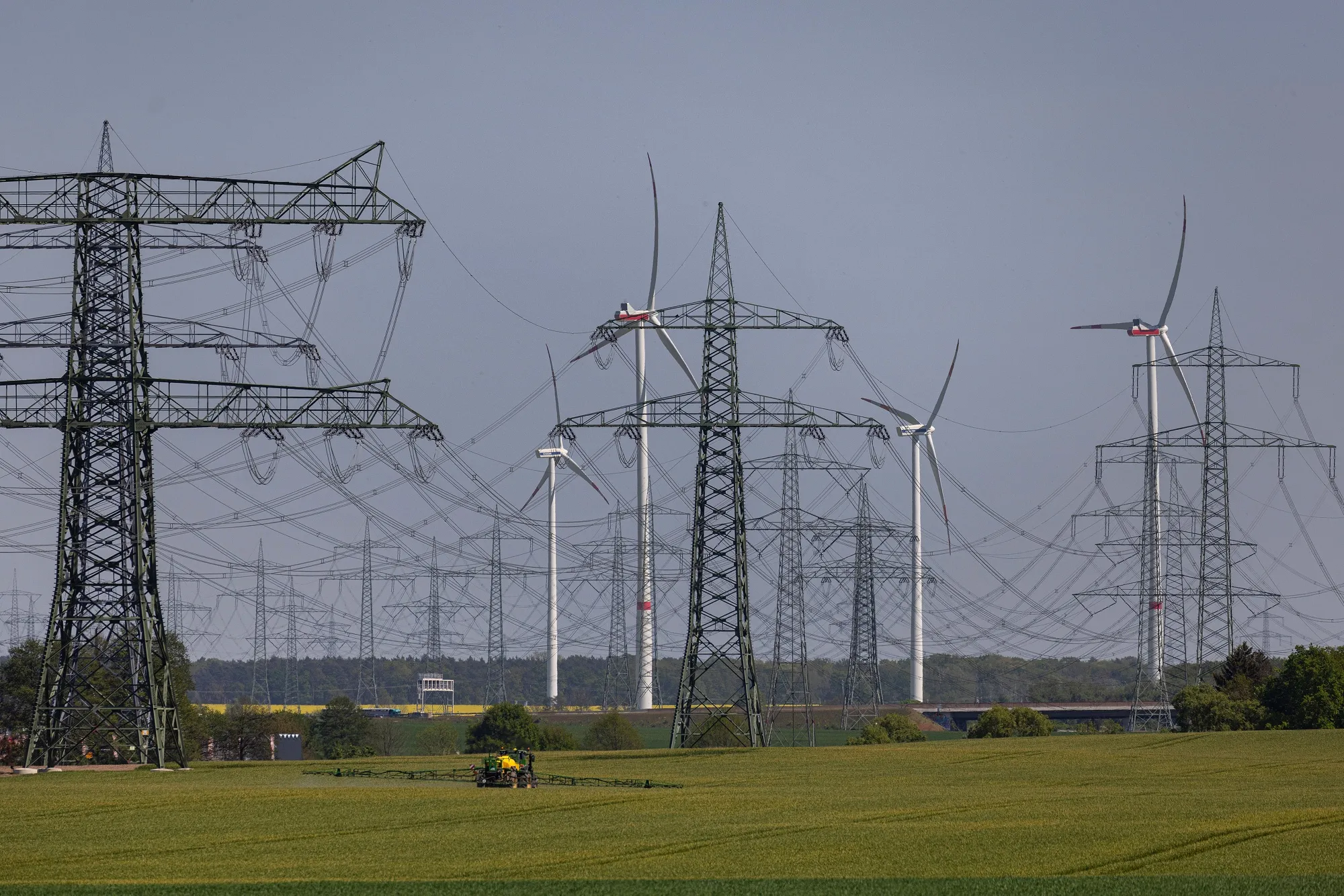 Wind turbines and electricity transmission pylons near Berlin.