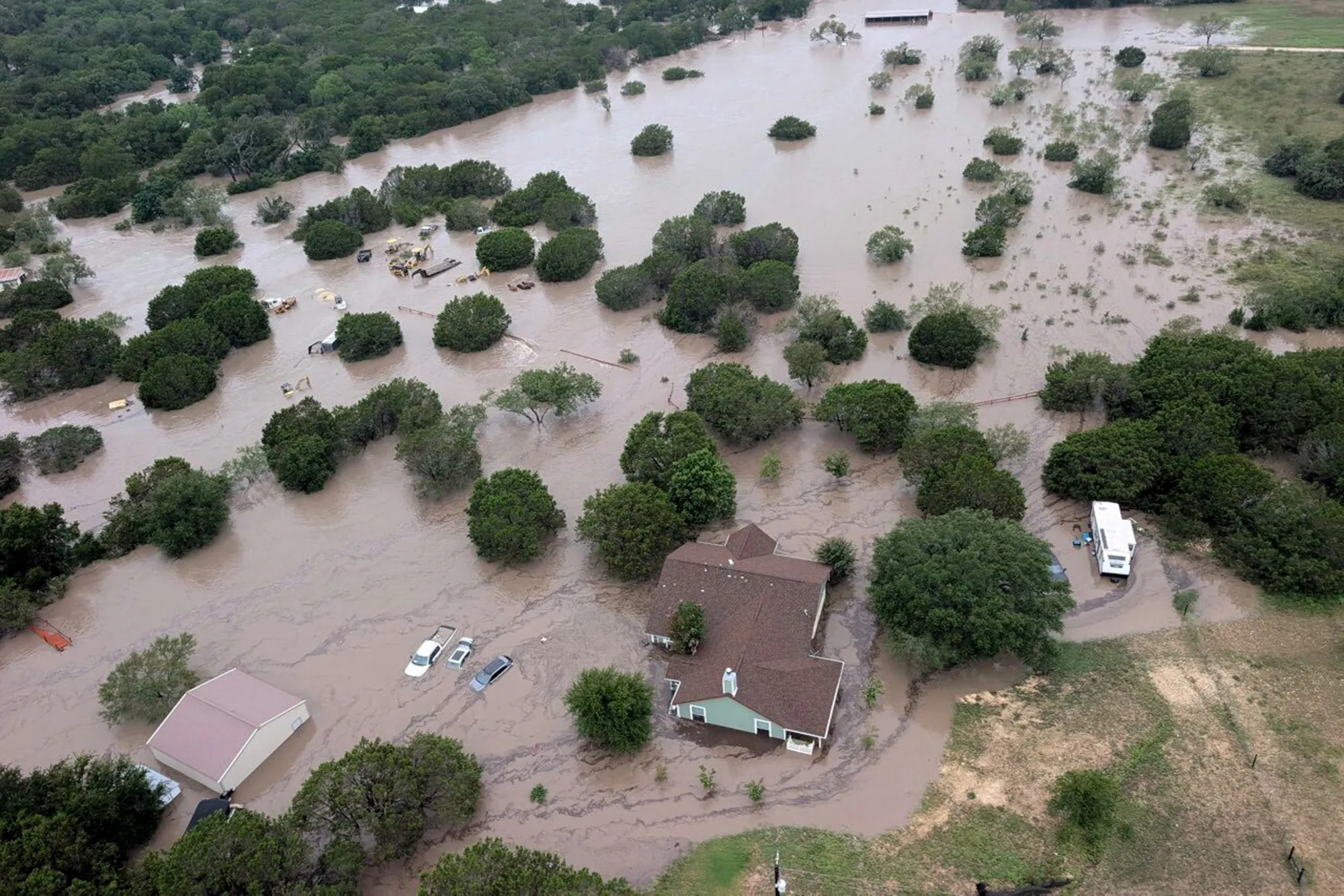 Homes submerged in floodwaters near Kerville, Texas, in a handout image provided by the US Coast Guard on July 5.