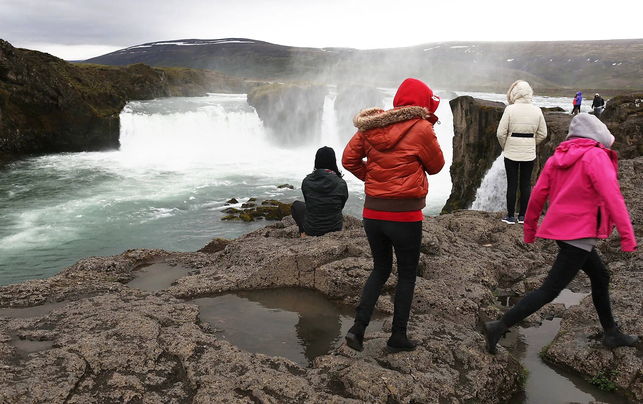 Visitors watch Gooafoss&nbsp;waterfall&nbsp;near Myvatn in&nbsp;Iceland.&nbsp;