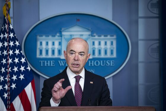 Singapore Warns Hospitals Strained; U.S. Boosters: Virus Update