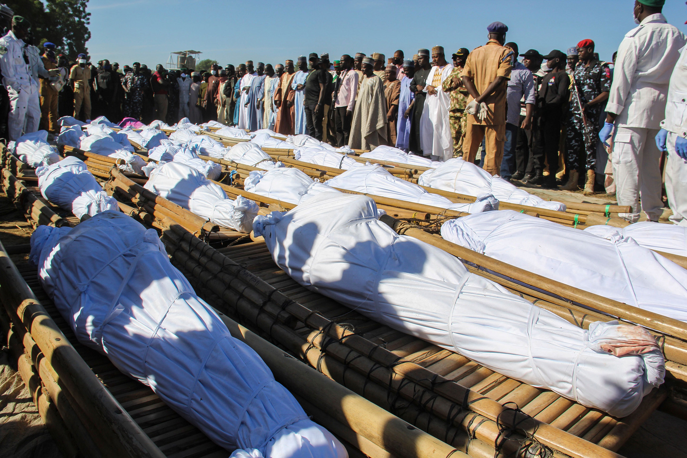 Mourners attend the funeral of 43 farm workers in Zabarmari, Nigeria, on Nov. 29.