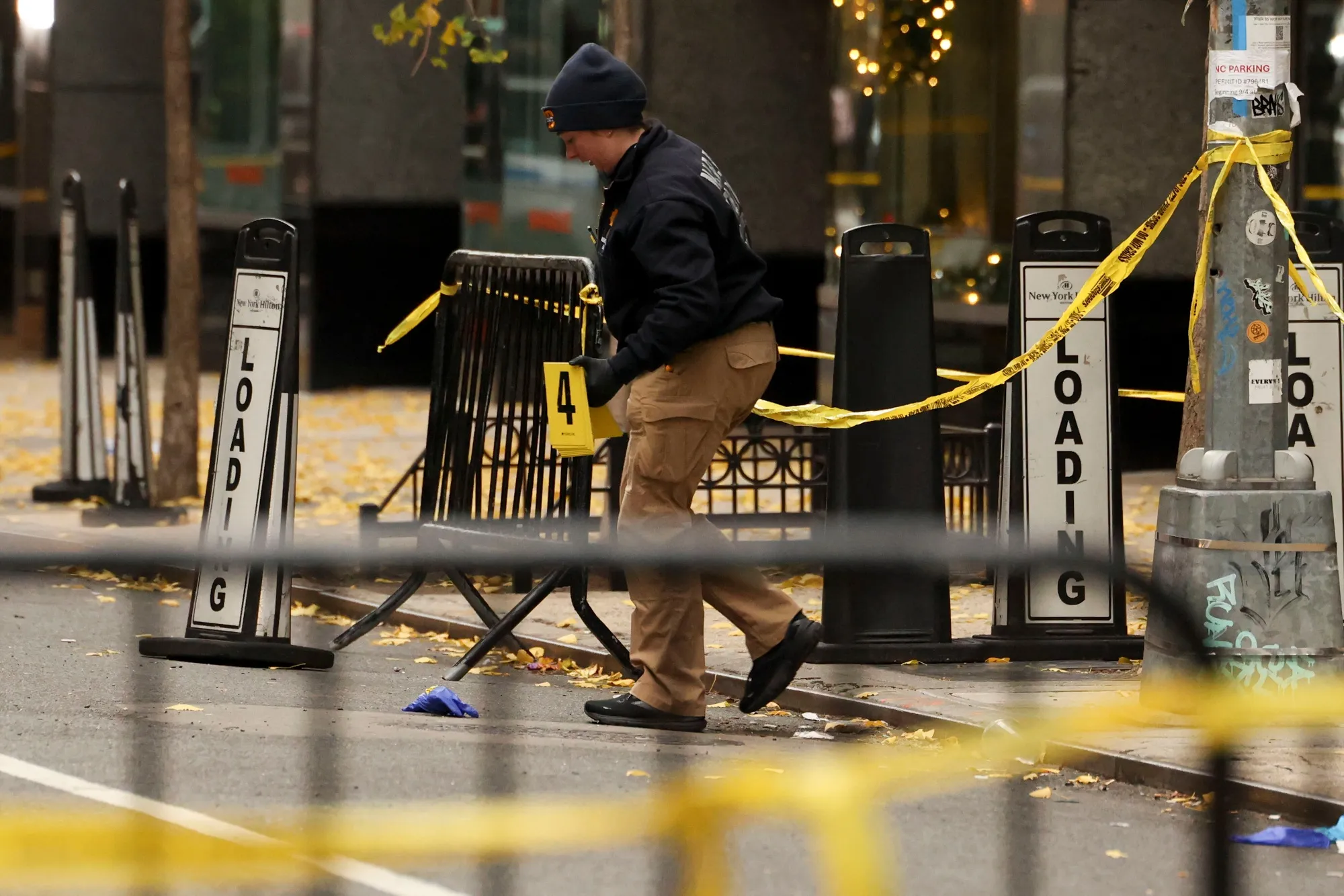 A law enforcement officer at the scene of the shooting in New York on Dec. 4, 2024.