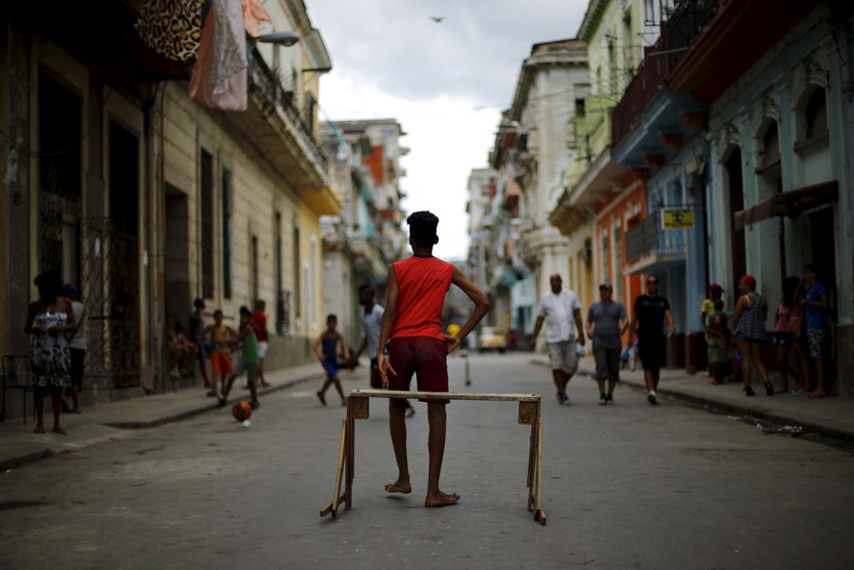 Children play soccer on a street in Havana, Cuba.