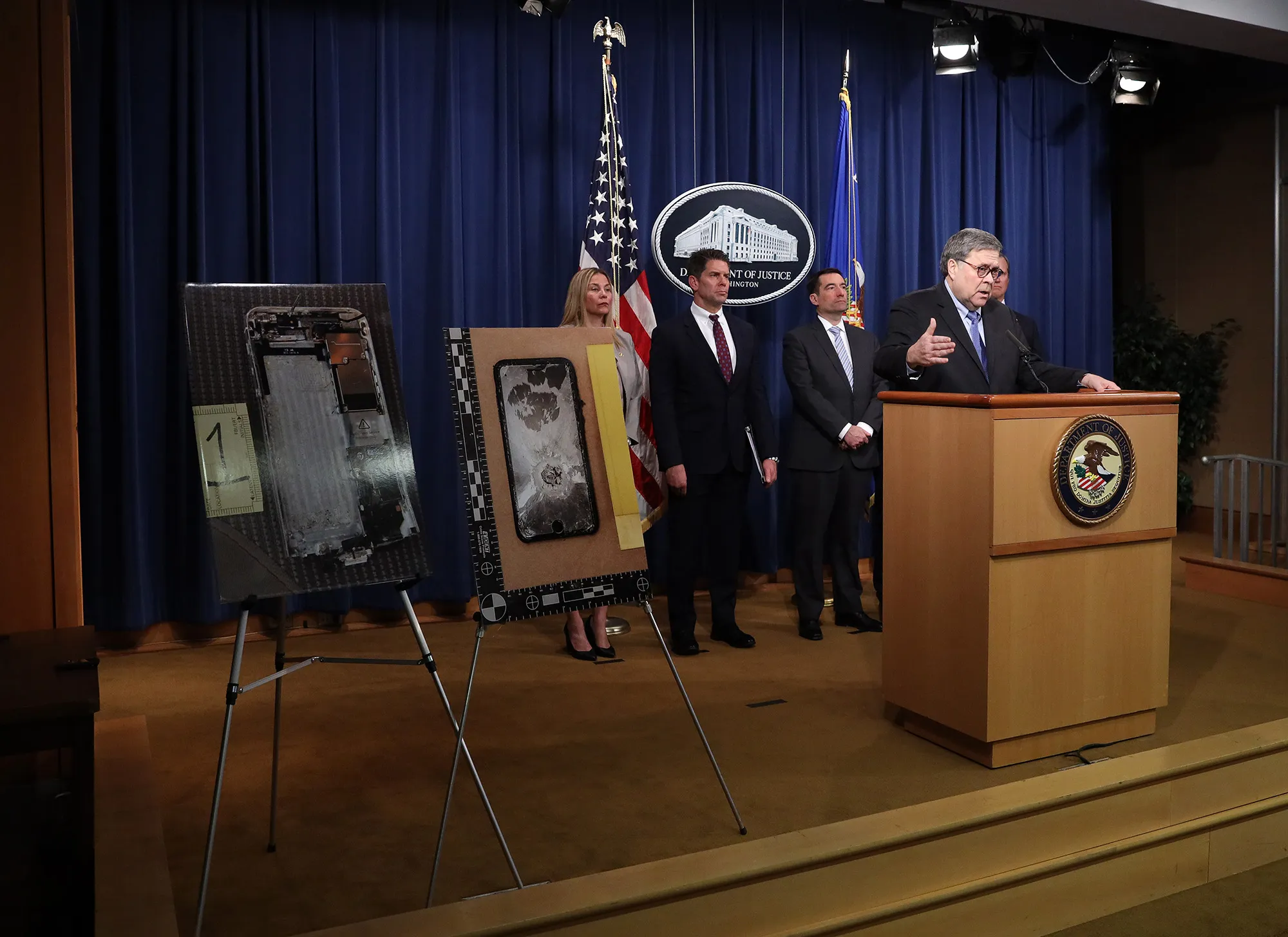 William Barr speaks near diplayed photos of the shooter’s cellphone, in Washington on Jan. 13.