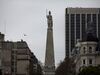 A statue stands over the Plaza de Mayo, marking the scene of the May 25, 1810 revolution, in Buenos Aires, Argentina.