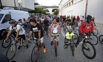 Cyclists gather and prepare to ride a 13-mile route though neighborhoods including Wynwood and Little Havana in downtown Miami.