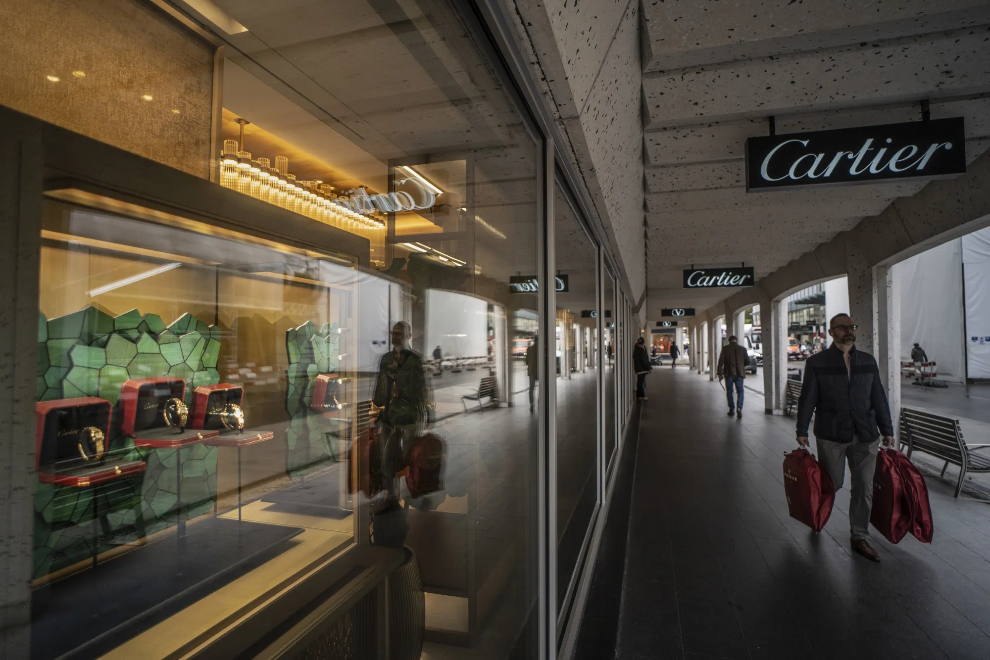 Watches in the window display of a Cartier luxury store in Geneva, Switzerland.