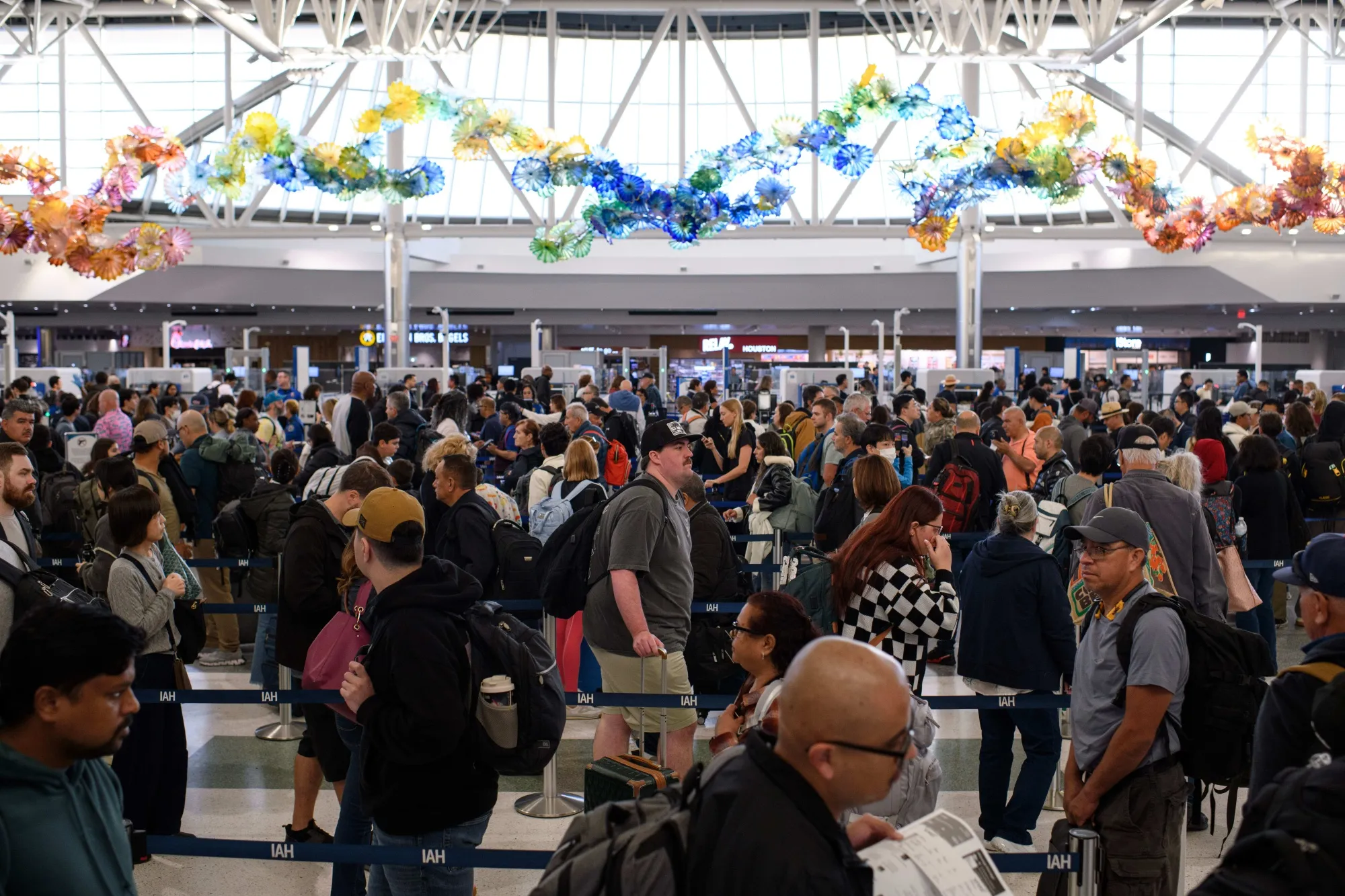 Travelers wait in line at a Transportation Security Administration (TSA) checkpoint at George Bush Intercontinental Airport (IAH) in Houston on&nbsp;Nov. 9.