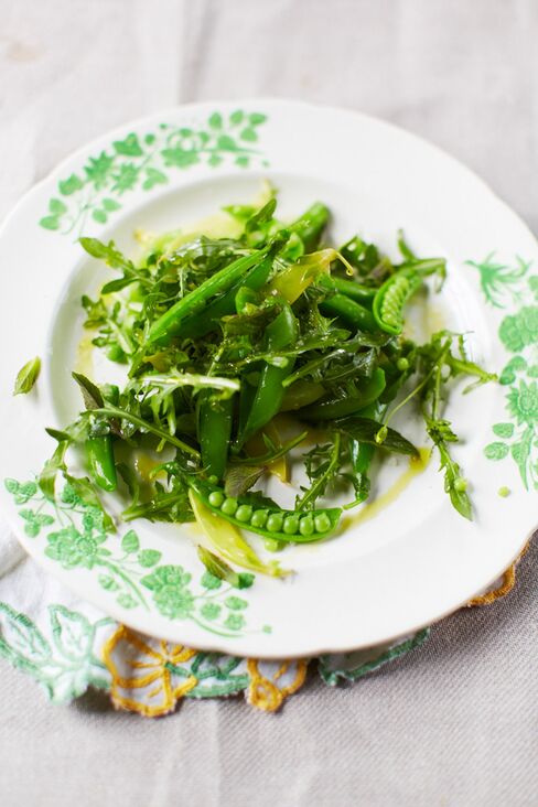 Raw sugar snap peas with mint and arugula, dressed in lemon and olive oil.