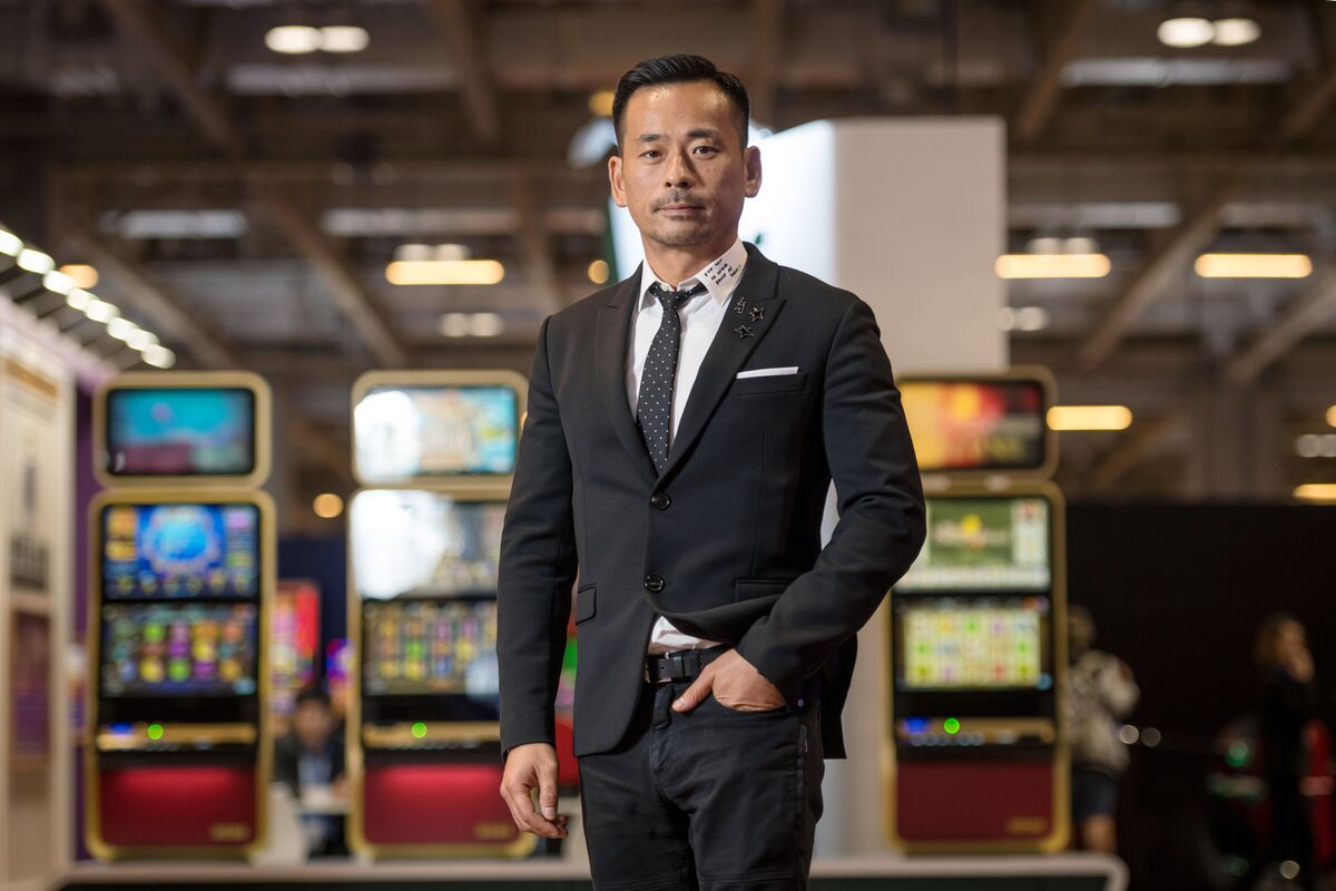  | Macau Casino Stocks Sink After Police Arrest City's Junket King - Bloomberg