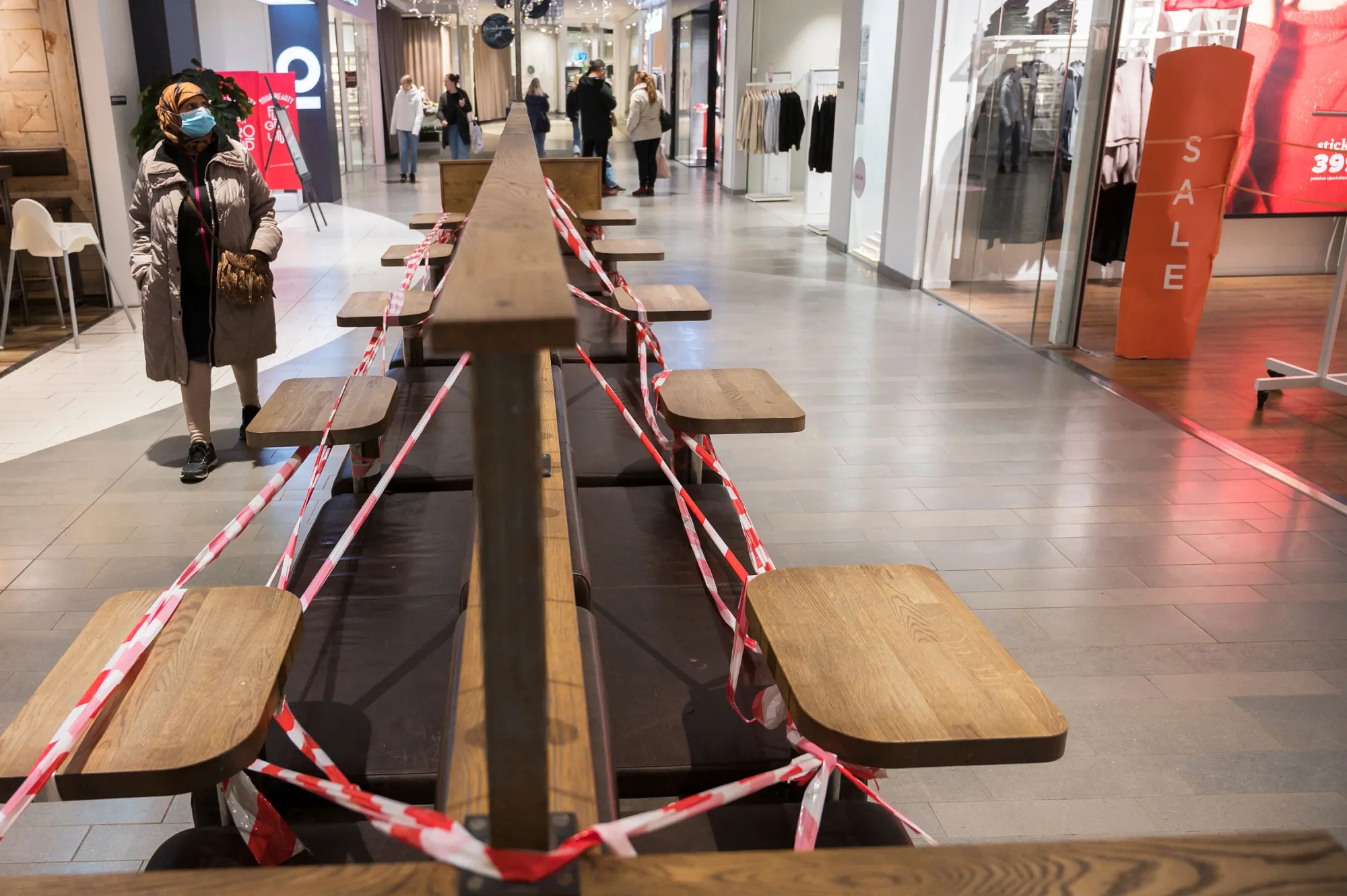 Benches&nbsp;taped off inside a shopping center in Uppsala, Sweden.