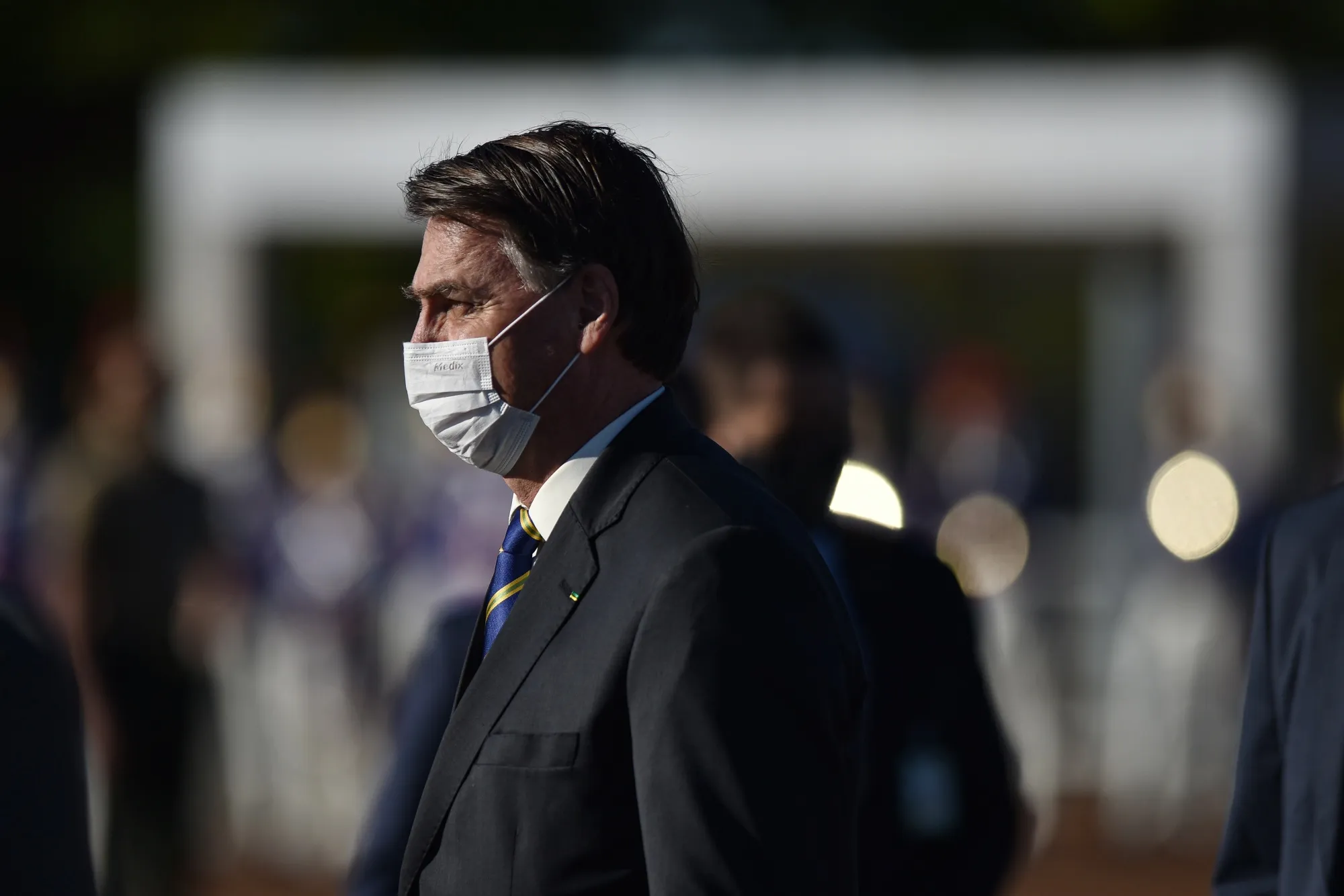 Jair Bolsonaro, Brazil's president, wears a protective mask during the National Flag Raising ceremony at Alvorada Palace in Brasilia on May 12, 2020.&nbsp;