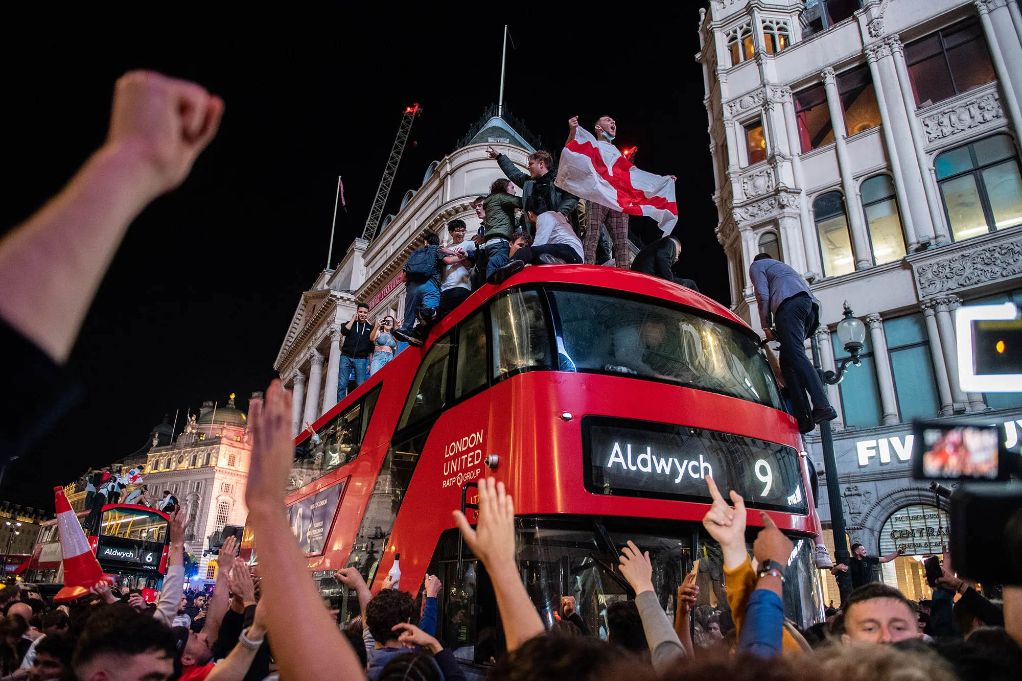 England fans celebrate in the streets surrounding Piccadilly after England beat Denmark in their semi final game on July 7.