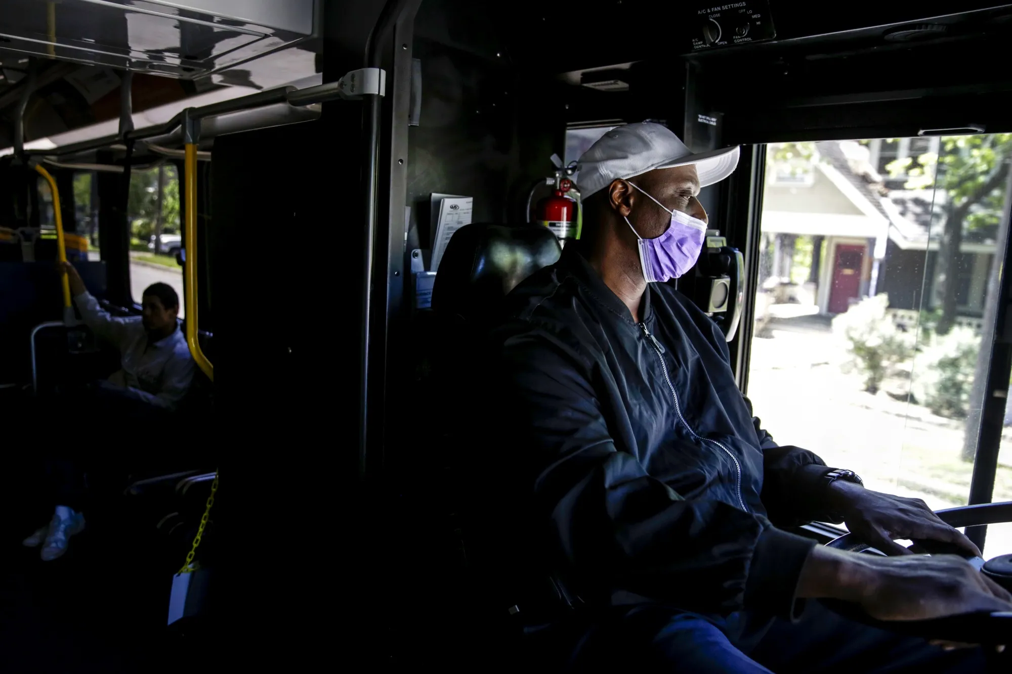 A bus driver wears a face mask in downtown Austin, Texas.