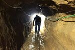 A Palestinian man approaches the Gaza Strip in one of many  smuggling tunnels from the border's Egyptian side