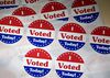 "I Voted Today" stickers sit on a table at a polling location in Philadelphia, Pennsylvania, U.S., on Tuesday, April 26, 2016. Donald Trump is poised to sweep five Northeast primaries today and Democrats Hillary Clinton and Bernie Sanders will compete as well in the contests in Connecticut, Delaware, Maryland, Pennsylvania and Rhode Island in what's become known as the Acela primary because of the Amtrak route through the region.
