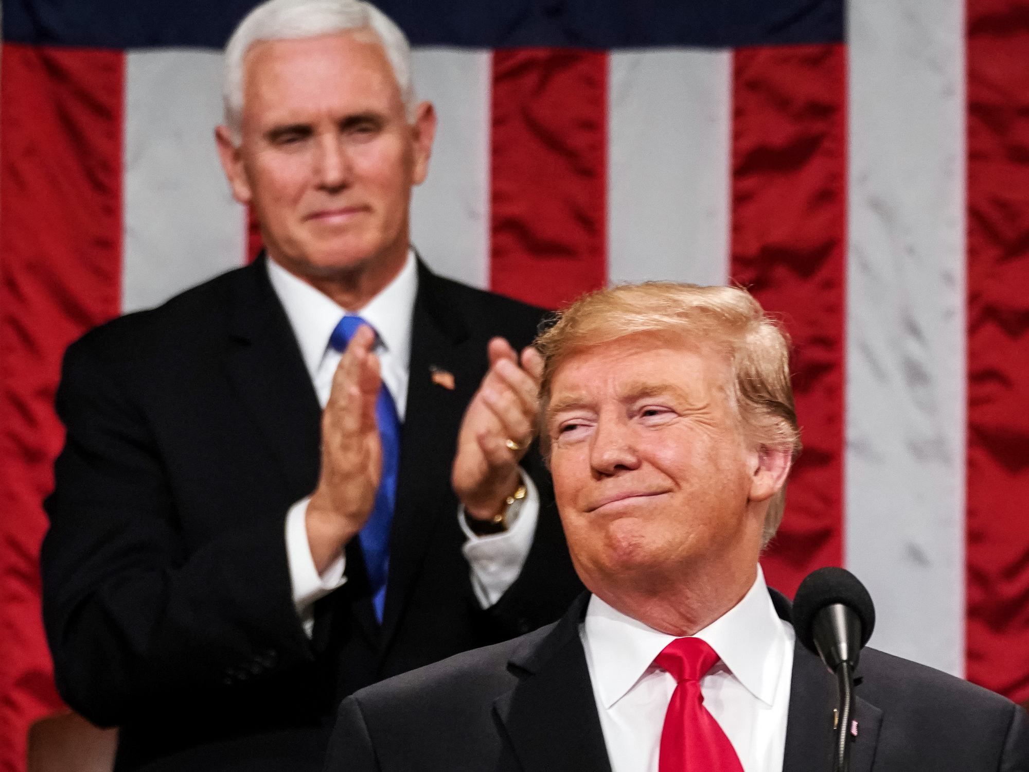 Mike Pence applauds Donald Trump during his State of the Union address in Feb. 2019.