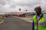 An Embraer SA 190 passenger aircraft, operated by Kenya Airways Ltd., on the tarmac at Jomo Kenyatta International Airport in Nairobi, Kenya.