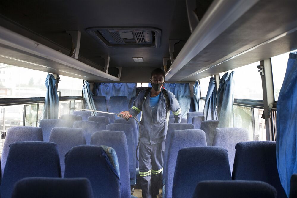 A worker disinfects a bus in Harare, Zimbabwe on Dec. 31, 2020.