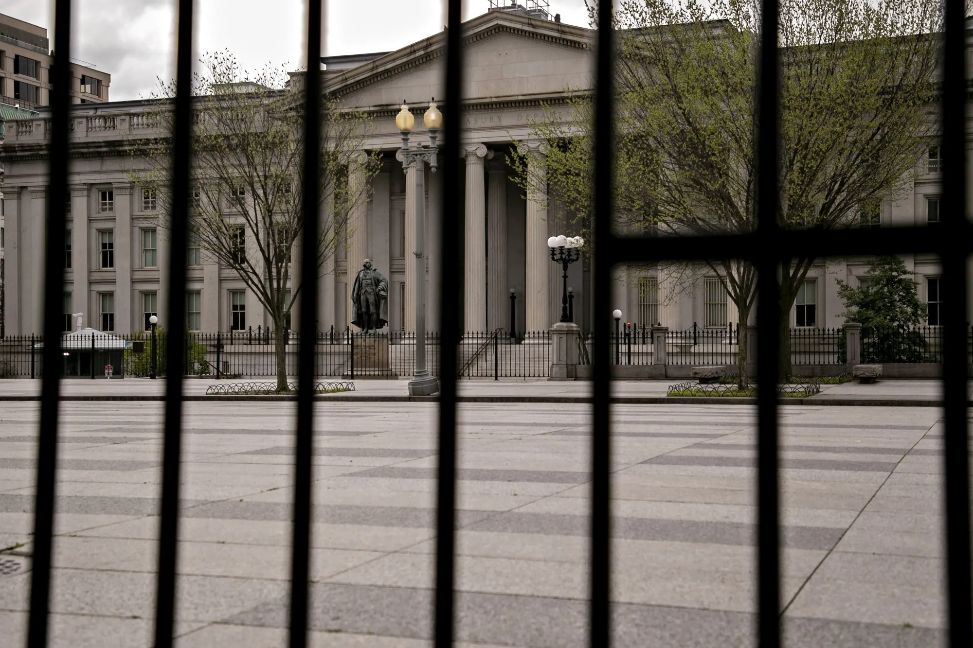 The U.S. Treasury building stands past fencing in Washington, D.C. on April 1.