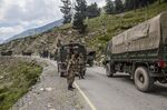 An Indian army convoy carrying reinforcements and supplies drive toward&nbsp;Leh on a highway bordering China in early September.