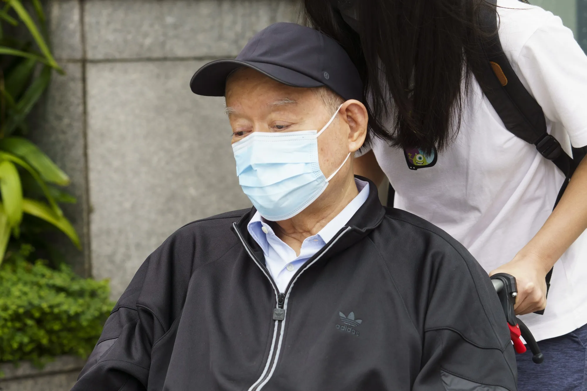 Lim Oon Kuin leaves the State Courts following a sentencing hearing in Singapore on Nov. 18.