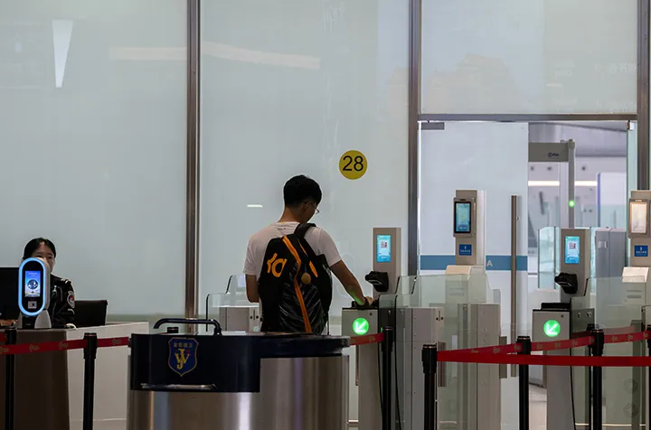 A traveler checks in using facial recognition technology in Beijing Daxing International Airport.