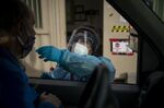 A healthcare worker administers a Covid-19 swab test in Longmont, Colorado.