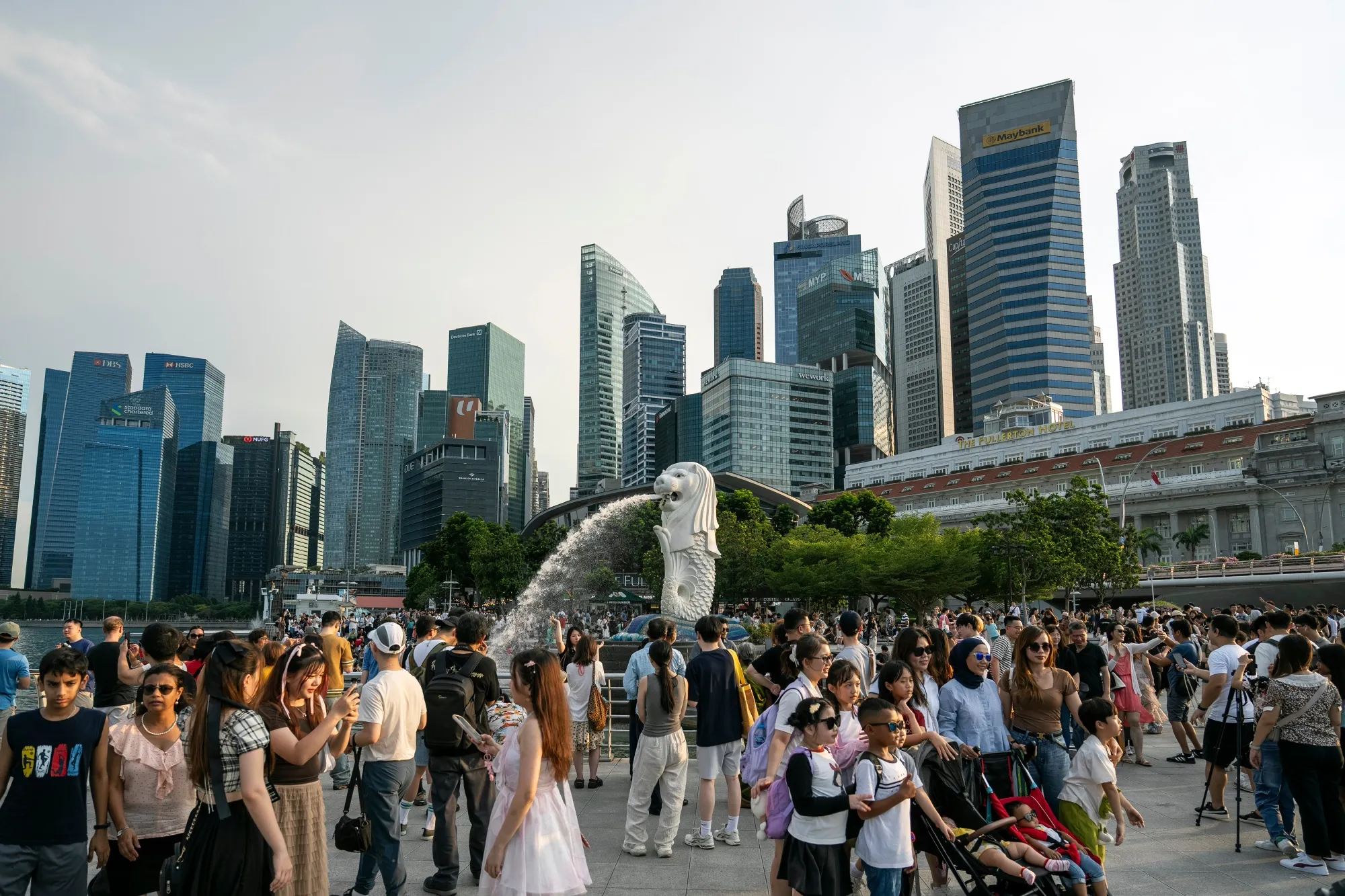The Merlion statue and buildings in Singapore. Photographer: Bryan van der Beek/Bloomberg.