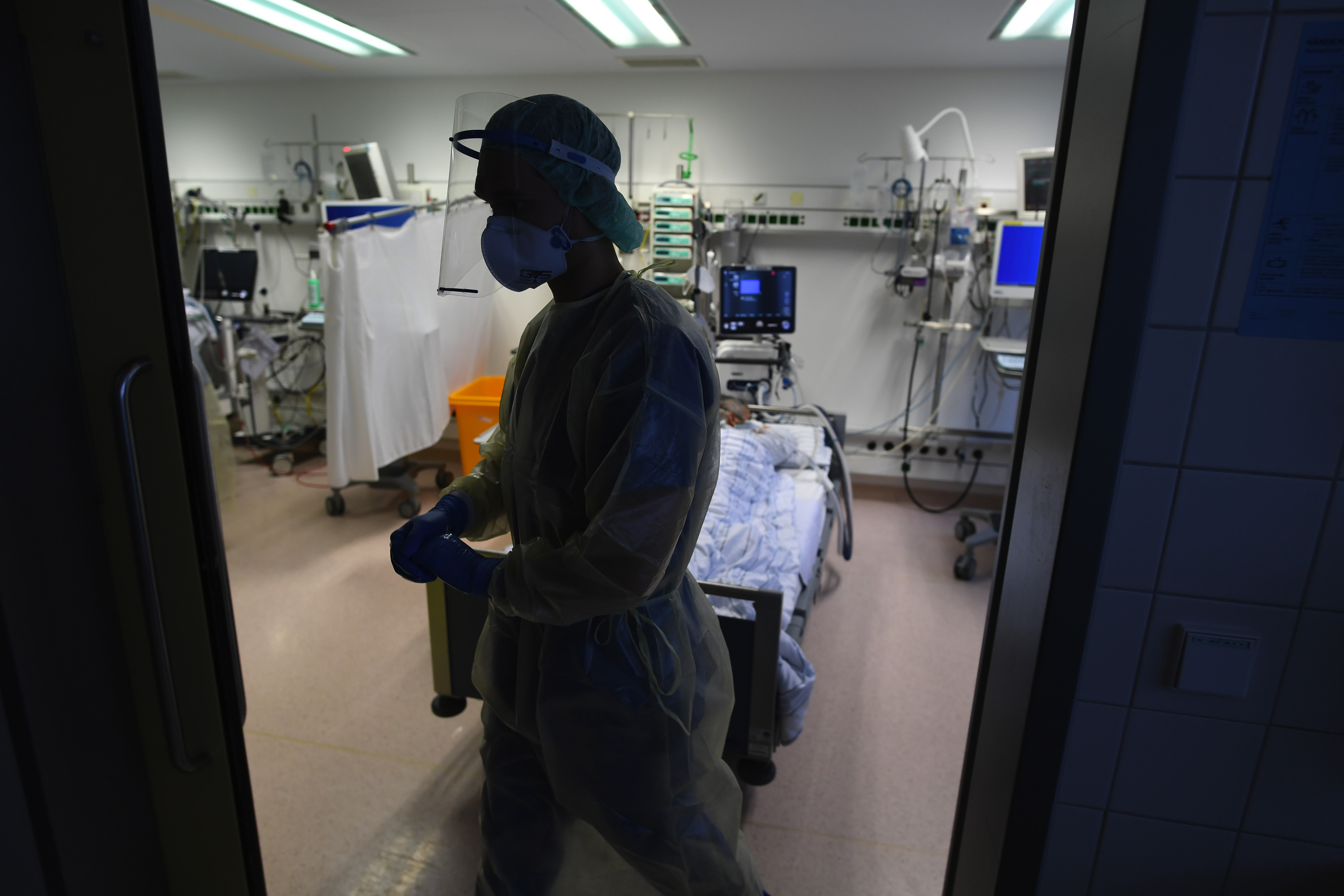 A healthcare worker and a Covid-19 patient in the ICU ward at a hospital in Stuttgart, Germany, on&nbsp;Jan. 12.&nbsp;