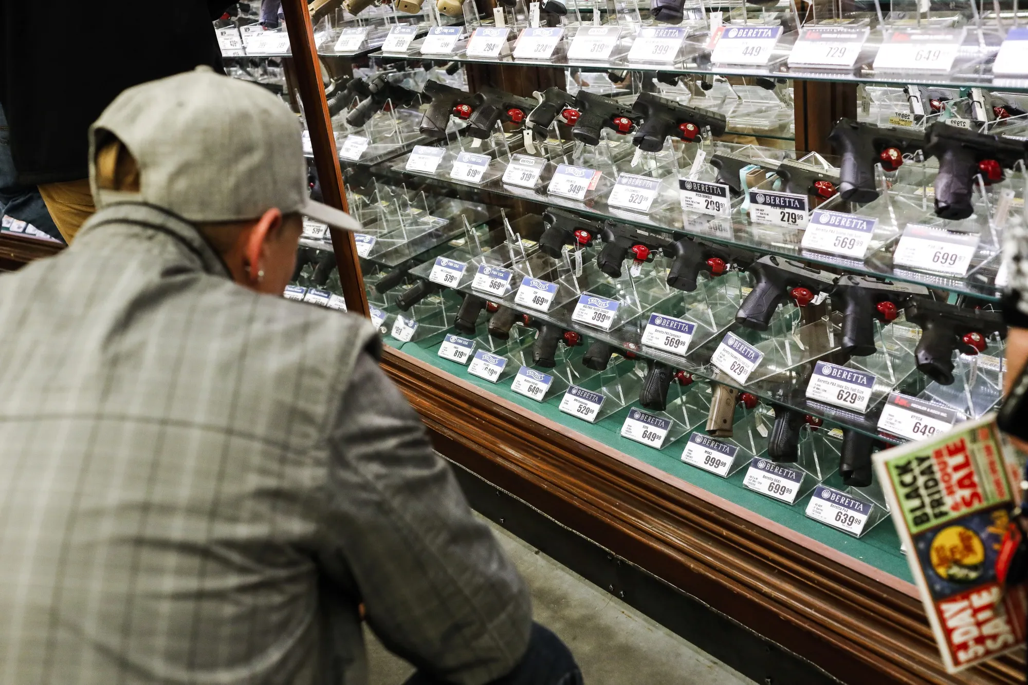 A shopper browses handheld firearms for sale inside a Bass Pro store on Black Friday in Tampa, Florida, on Nov. 23, 2018.&nbsp;