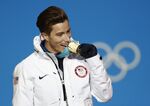 Men's halfpipe gold medalist Shaun White, of the United States, bites his medal during the medals ceremony at the 2018 Winter Olympics in Pyeongchang, South Korea, Wednesday, Feb. 14, 2018. As Shaun White embarked this month on the quest to make his fifth Olympics, the world’s most famous halfpipe rider finds living a life full of calculated risks is still part of his DNA. It's a mindset that is less taken for granted these days in all-or-nothing sports like his than it was a mere 12 months ago.  (AP Photo/Patrick Semansky, File)