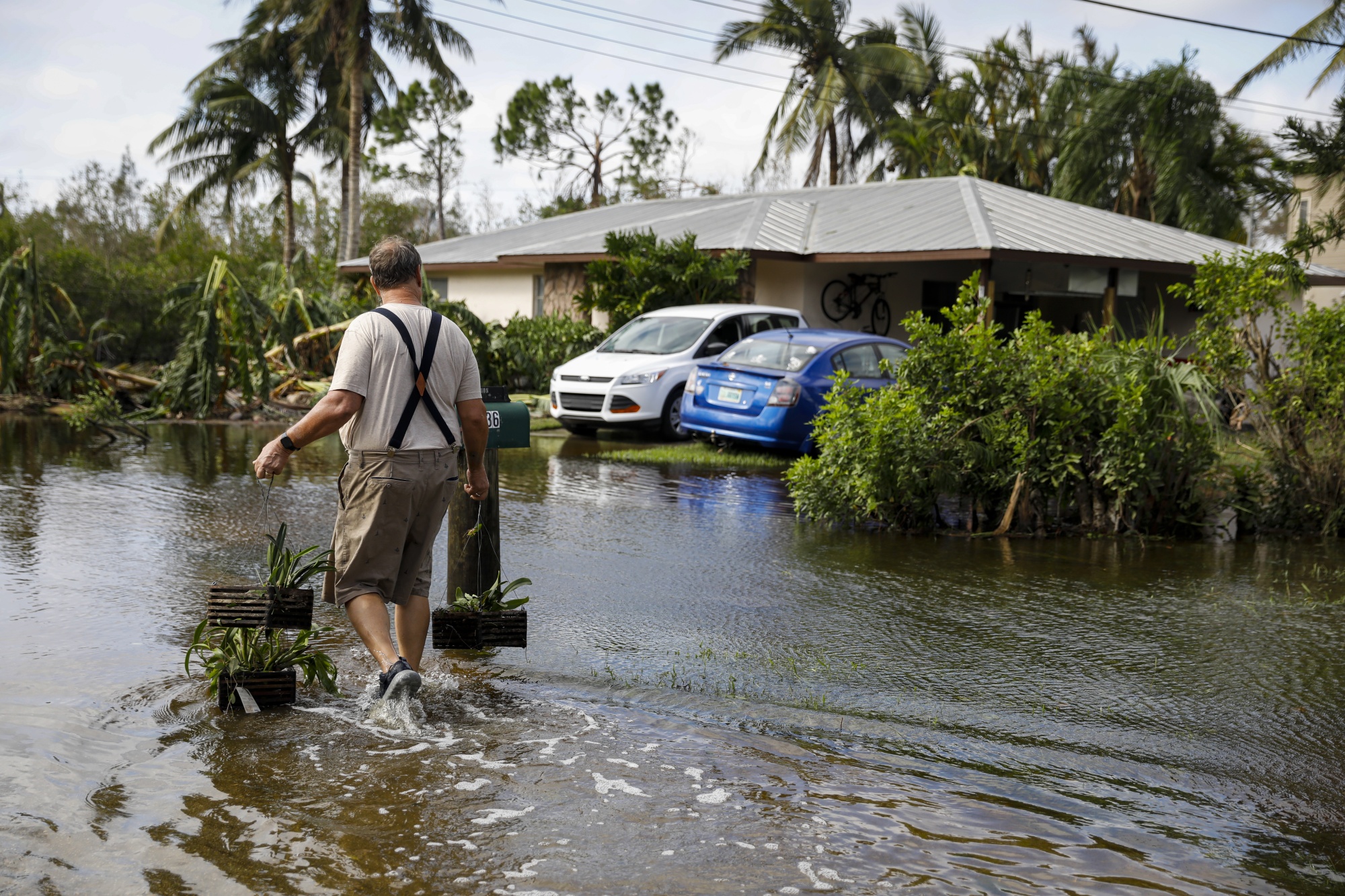 A resident walks home in the aftermath of September’s Hurricane Ian in Fort Myers, Florida.