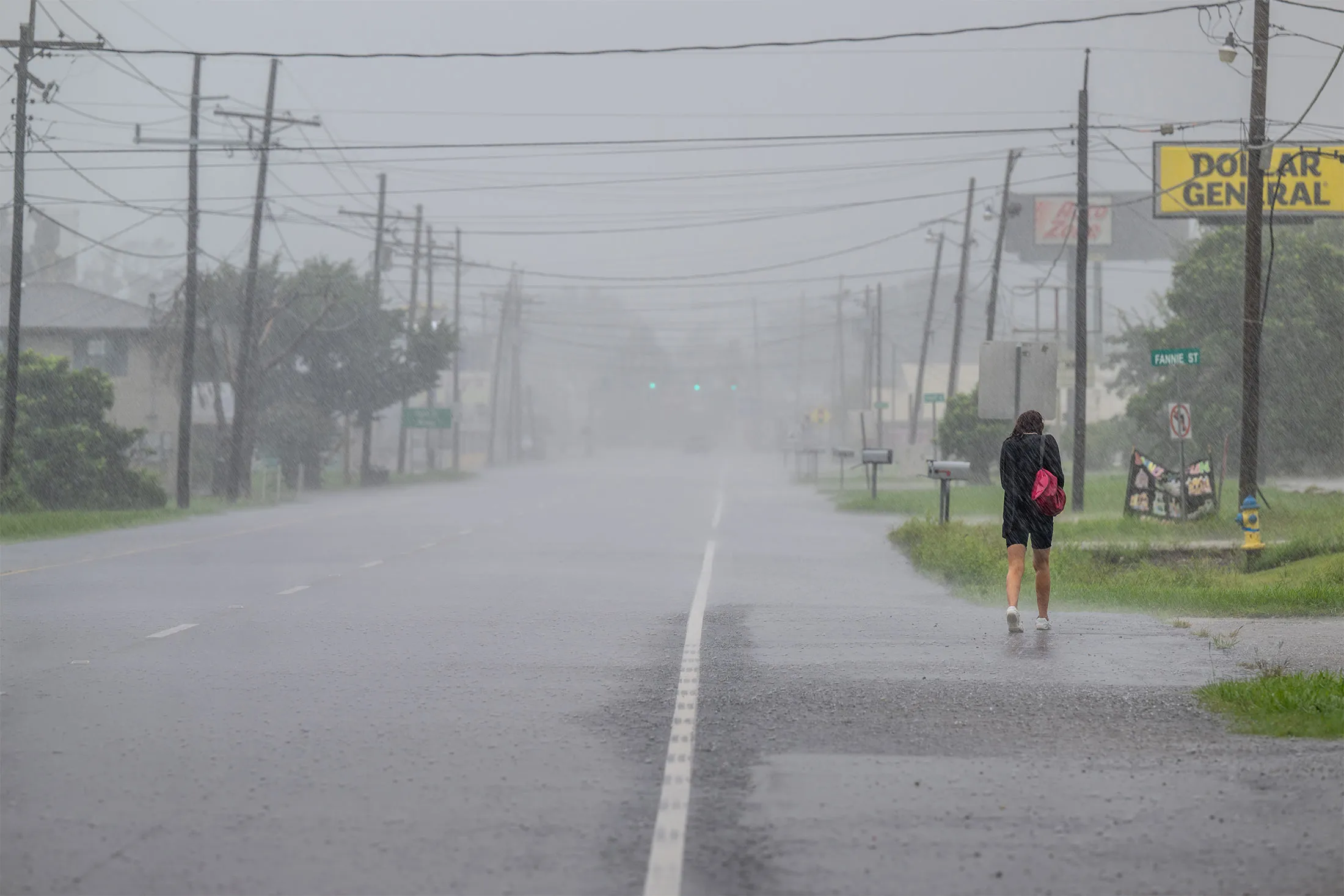 A person walks through rain&nbsp;as Hurricane Francine hits the area in Houma, Louisiana, on Sept. 11.&nbsp;