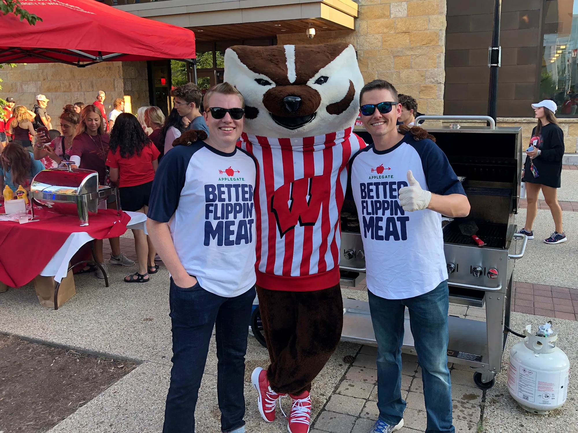 At the Badger Welcome BBQ:&nbsp;Zach Robinson, Applegate Foodservice sales representative;&nbsp;Bucky Badger;&nbsp;Blake Flores, Applegate Foodservice national sales manager.&nbsp;