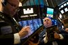 Traders work on the floor of the New York Stock Exchange (NYSE) in New York, U.S., on Friday, March 9, 2018. U.S. stocks rose while Treasuries fell as the latest labor report showed the American economy continued to strengthen without the prior month's rapid wage gains that stoked inflation fears.