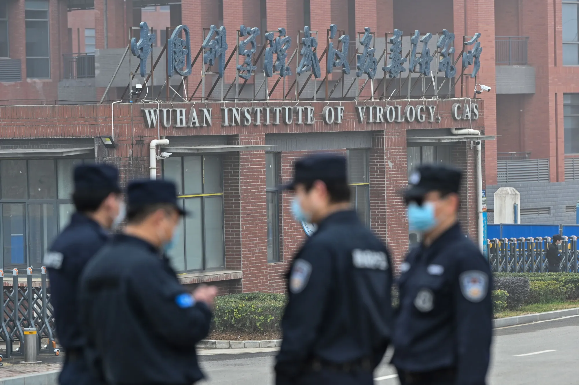 Security personnel stand guard outside the Wuhan Institute of Virology in Wuhan.