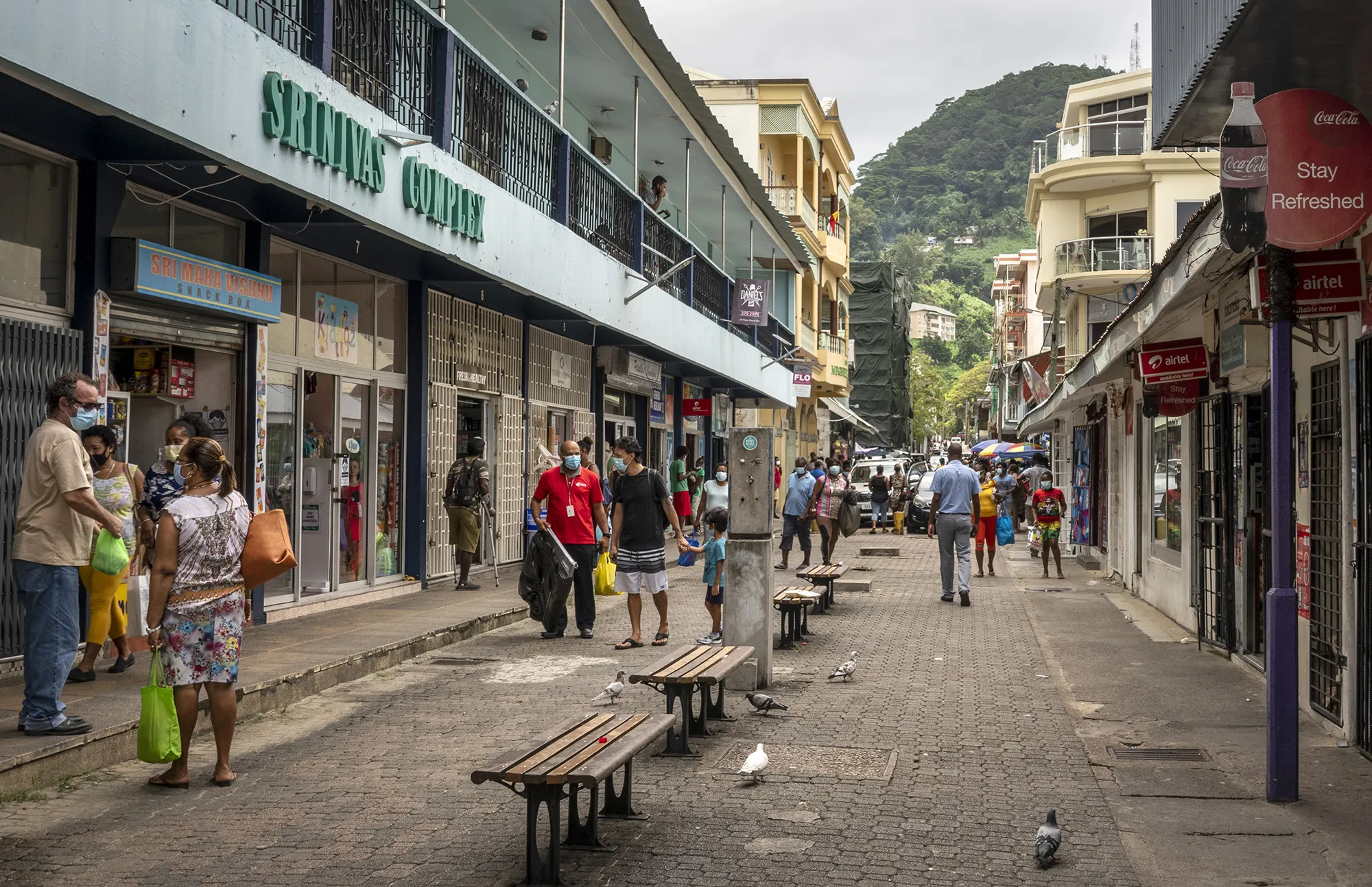 Pedestrians&nbsp;walk on a street in Victoria, Mahe Island, Seychelles, on Feb. 25.&nbsp;