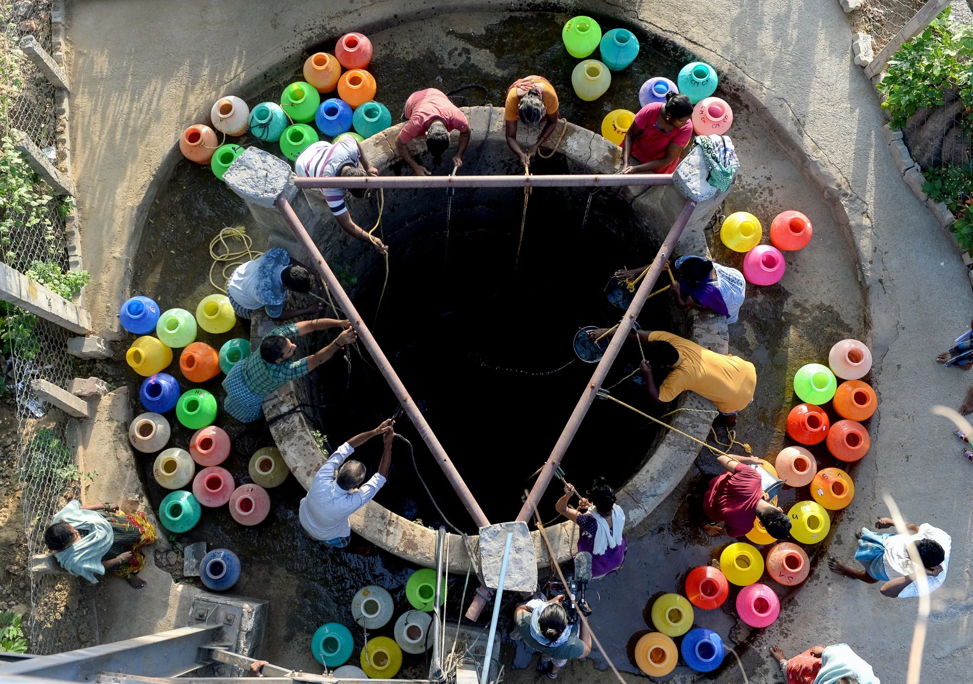 Chennai residents gather water from a communal well.