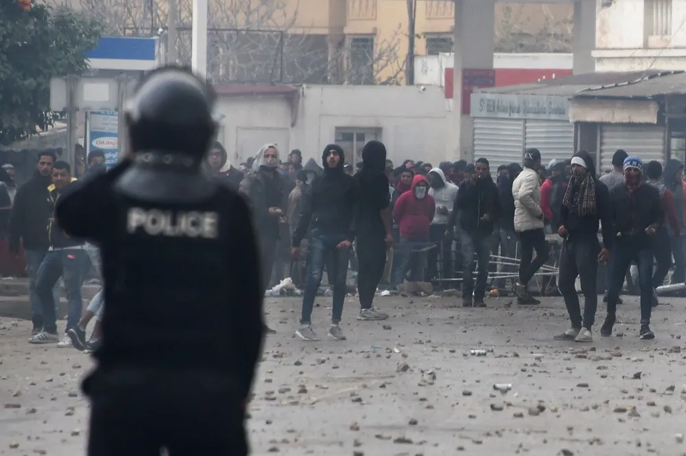 Tunisian protesters clash with security forces in the town of Tebourba.