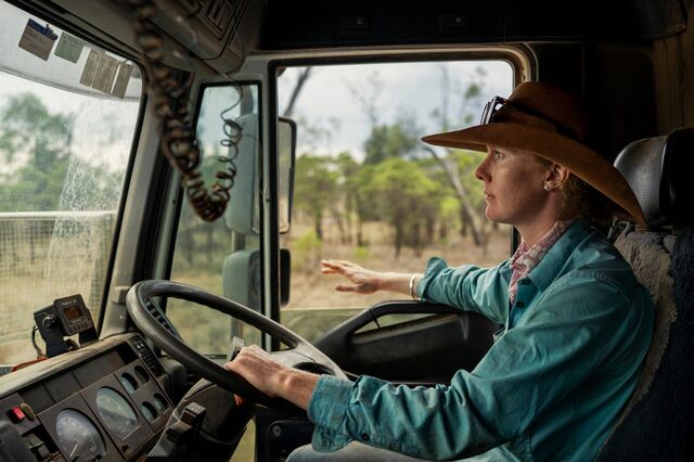 Bonnie, who works part time as a teacher in addition to her farm responsibilities, driving a truck.