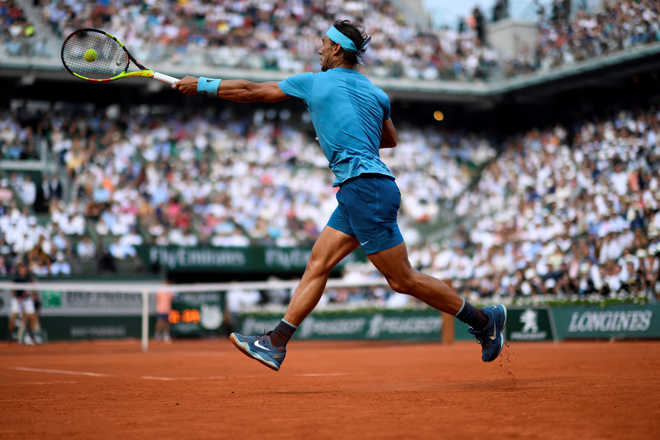 Spain's Rafael Nadal plays a forehand return to Austria's Dominic Thiem during their men's singles final match on day fifteen of The Roland Garros 2018 French Open tennis tournament in Paris on June 10, 2018. (