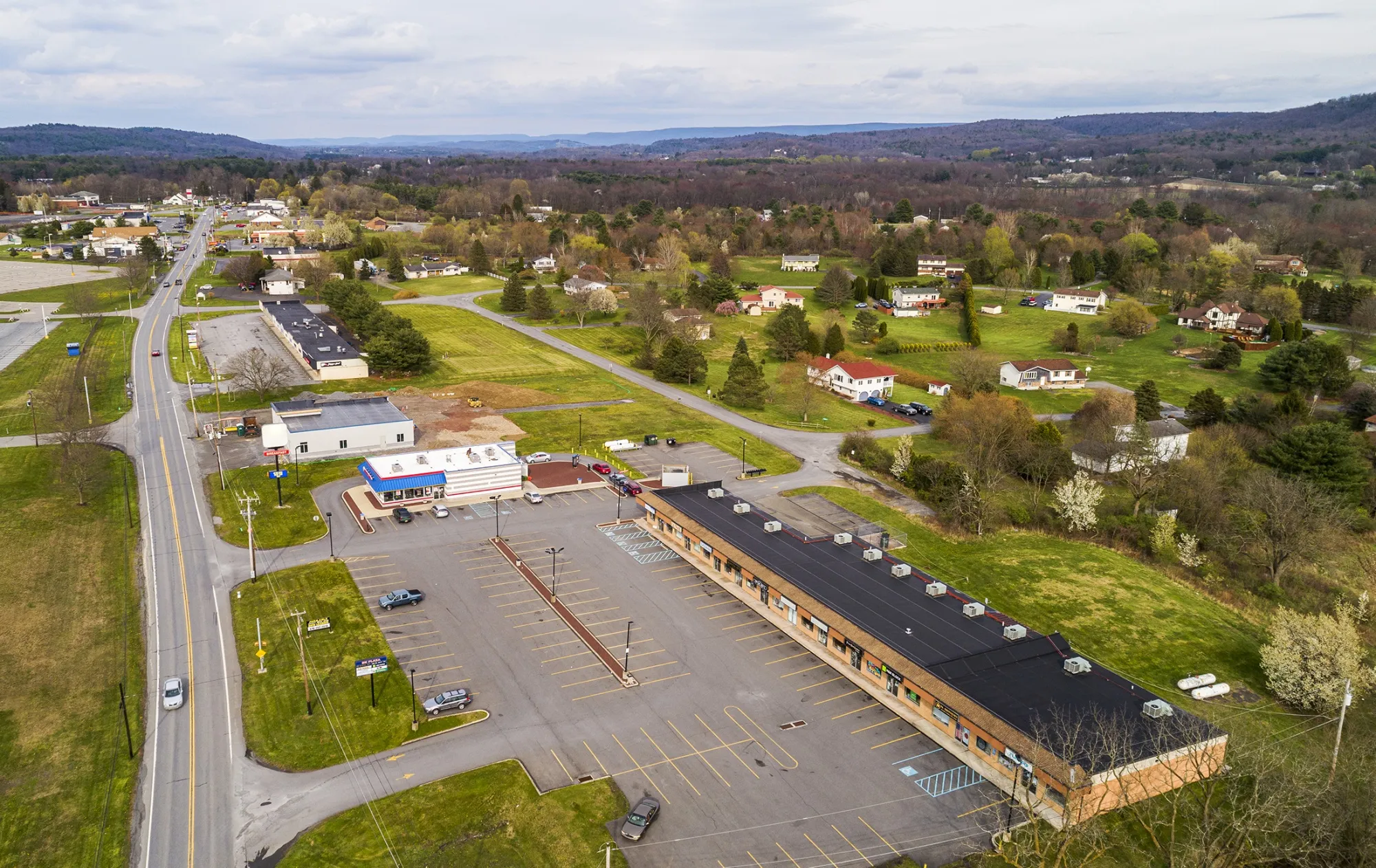 Small businesses are&nbsp;struggling because of stay-at-home orders caused by the Covid-19 pandemic. An empty parking lot of a&nbsp;plaza where stores are closed.