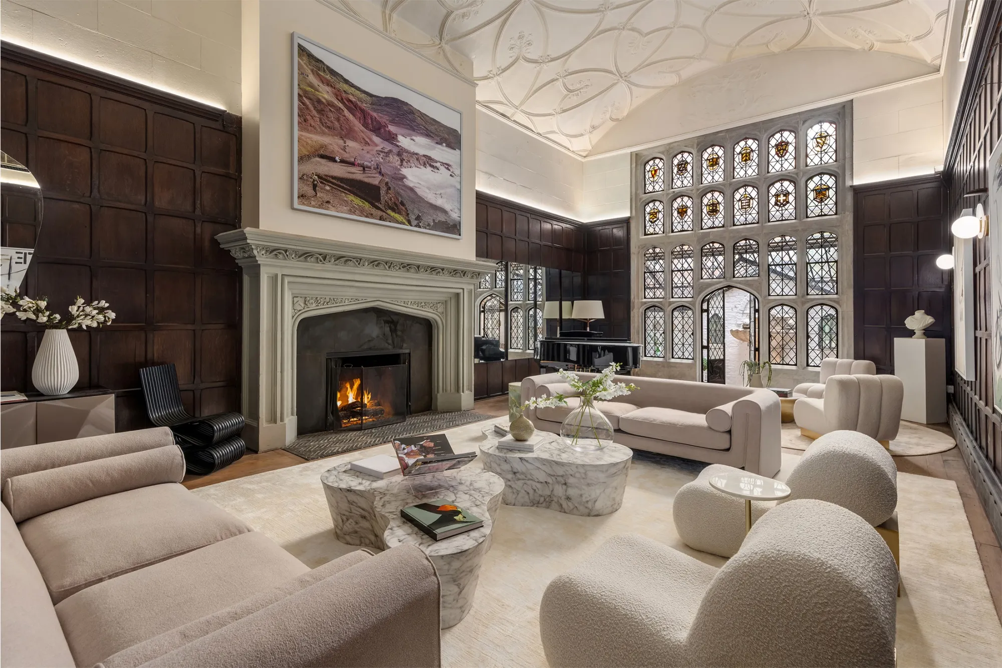 The townhouse's two-story great room leads to a glass-enclosed garden.